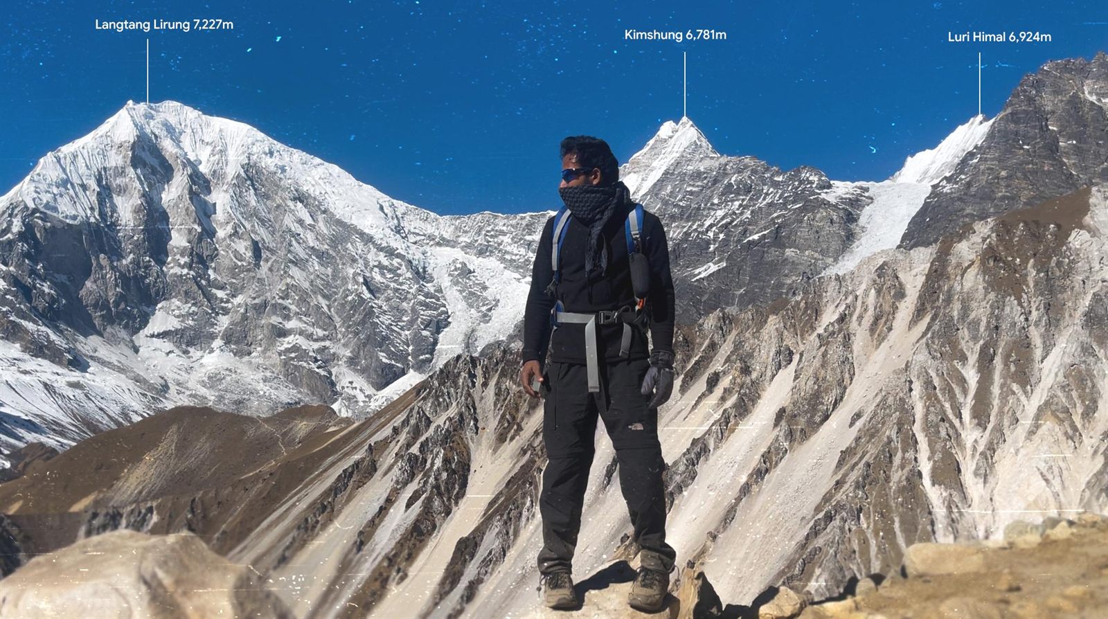 Beck Hussian on a ridge above the Langtang valley with Langtang Lirung behind him