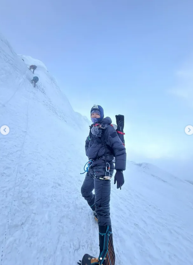 Sujan Suwal on a fixed line on a steep snow and ice slope