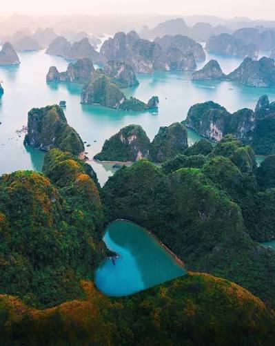 Karst islands scattered across Ha Long Bay seen from above