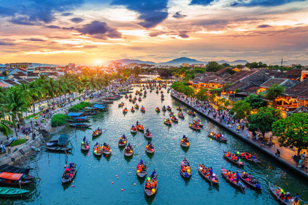 Boats on the Thu Bon river at sunset in Hoi An